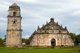 Philippines: Bell tower and church with its huge buttresses, San Agustin (St. Augustine) Catholic Church, Paoay, Ilocos Norte, Luzon Island